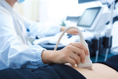 Sonogram Tech Scanning Patient